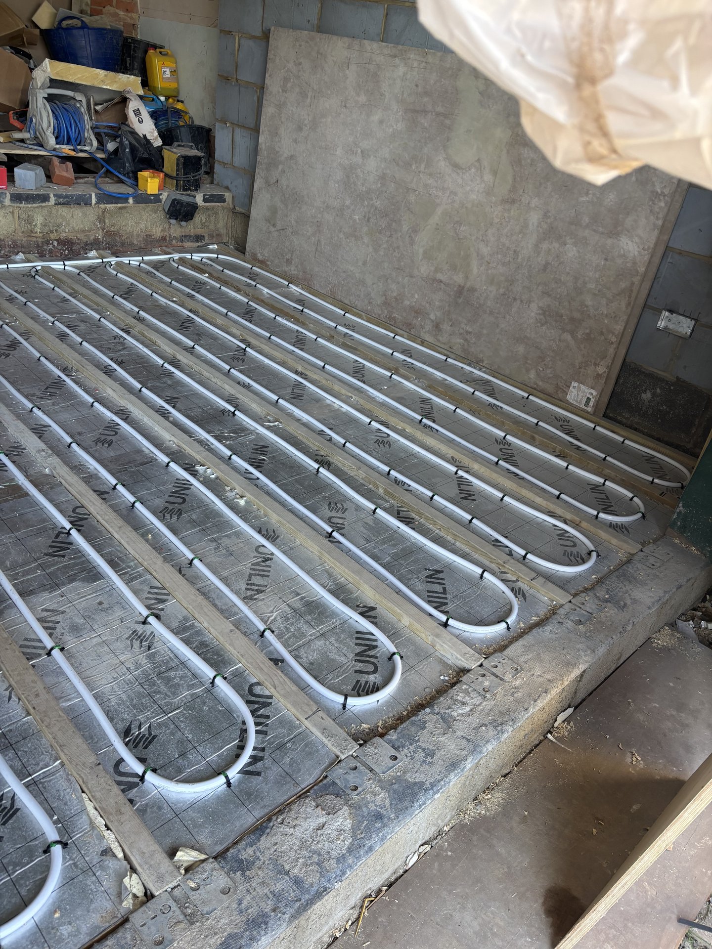 Pipework clipped to insulation