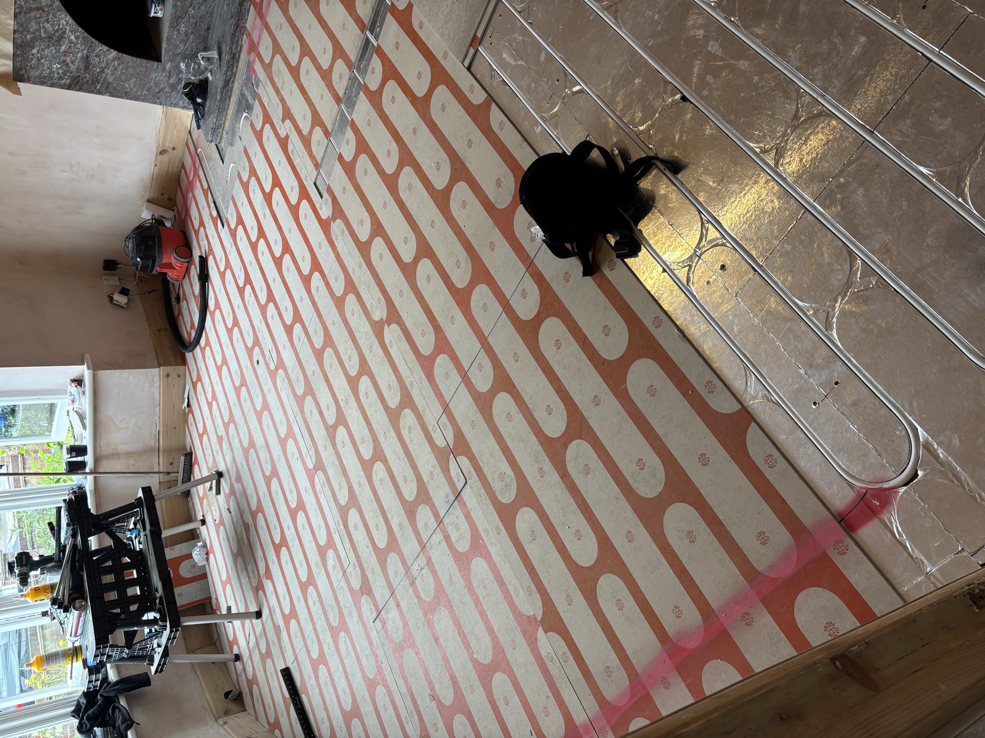 Printed layout markings guiding the pipe runs