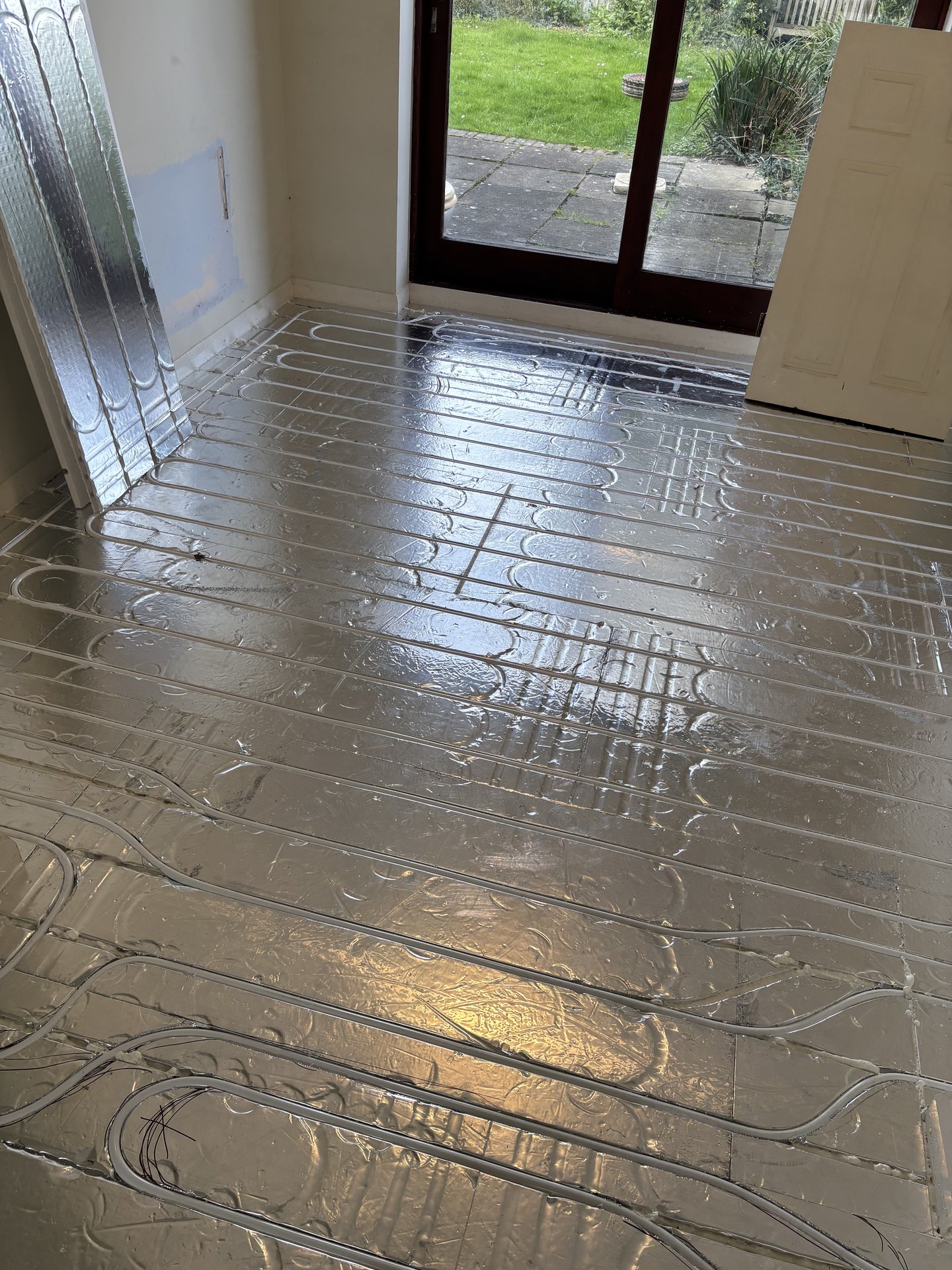 Insulation layer below joist tops